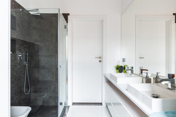 Modern bathroom with grey and white tiles