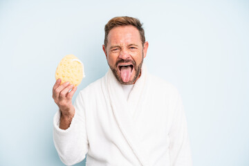 middle age man with cheerful and rebellious attitude, joking and sticking tongue out. shower concept