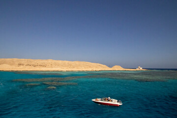 Holidaymakers enjoying the sea and sun at Small Giftun island near Hurghada, Egypt