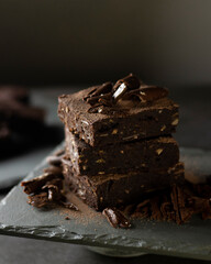 Chocolate Brownie with banana and almond on slate