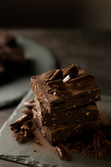 Chocolate Brownie with banana and almond on slate