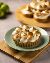 Lemon Meringue fresh pie on green plate
