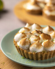 Lemon Meringue fresh pie on green plate