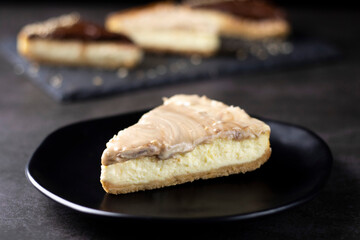 White chocolate Cheesecake on black plate