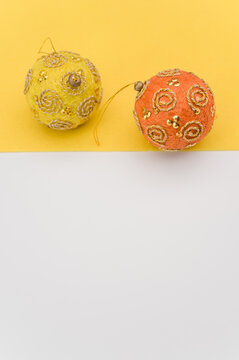 Christmas Time Paper Mache Decoration Balls On A White Yellow Background