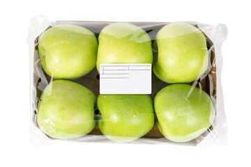 Packed and labeled green apple on isolated white background