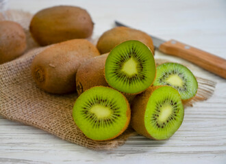 ripe kiwi on wooden background
