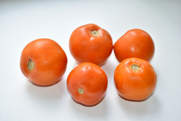 Large juicy tasty fruits of tomatoes close-up at home