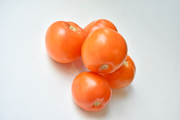 Large juicy tasty fruits of tomatoes close-up at home