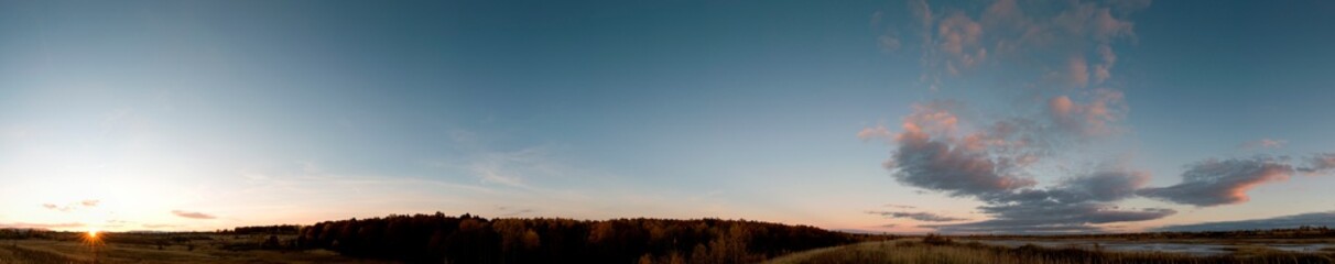 bright sunrise in the mountains with blue sky