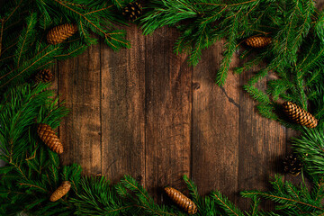 Christmas background. Fir branches on the background of wooden boards. background. Fir branches on the background of wooden boards.