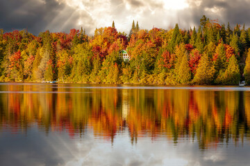 Lac Creuxl in Autumn showing fall colors in cottage country, Quebec Canada. - 465380494