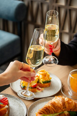 woman drinking champagne in the restaurant