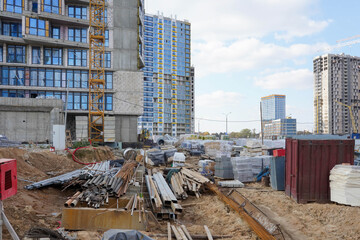 Photo of the construction at the construction site of a multi-storey buildings and houses