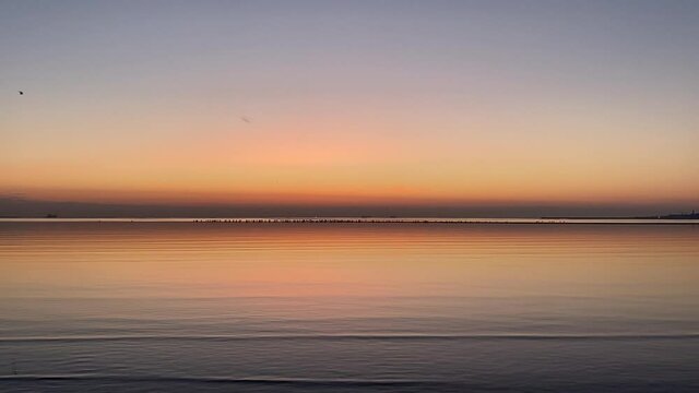 Peaceful, reflective dawn over Dublin Bay, Ireland
