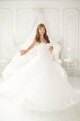 Fototapeta premium Beautiful luxury bride in elegant white dress