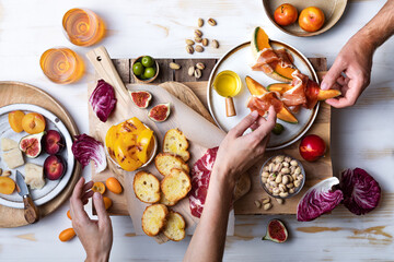 Flat-lay of  appetizers table with italian antipasti snacks. Family, friends holiday gathering,...