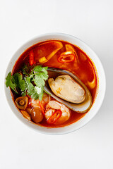 Bouillabaisse. Traditional French fish soup. Top view on white background.