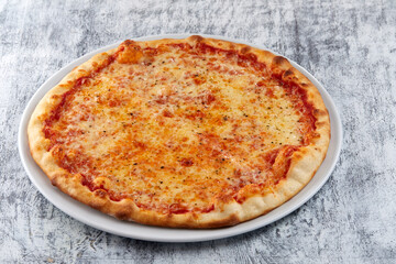 fresh pizza on the white plate