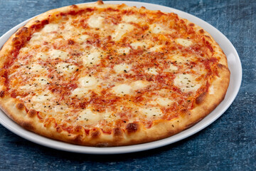 fresh pizza on the white plate