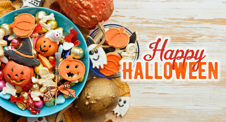 holiday Halloween candy bowl of cookies, candy, chocolates and sweets, Halloween Jack o Lantern - Trick or Treat Halloween card dark background