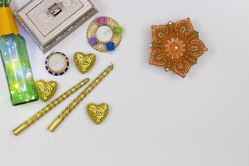 Handcrafted Eco Friendly Clay Diya Deep Dia decorative lights and golden candle heart shaped with gift box and copy space