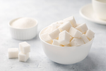 Fototapeta na wymiar Bowl of white sugar cubes.