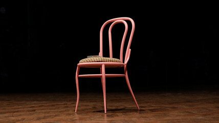 Lonely chair on a theater stage. Pink chair on with black background. Seat on stage waiting for the...