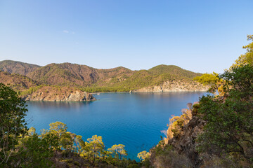 Fototapeta premium Beautiful nature landscape of Turkey coastline. View from Lycian way to small bay of Mediterrain sea. This is ancient trekking path famous among hikers.