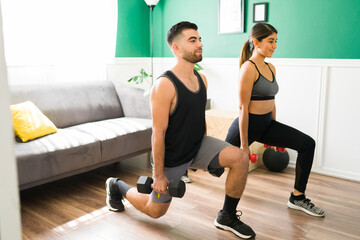 Workout partners training with weights