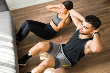 Fitness couple doing sit ups