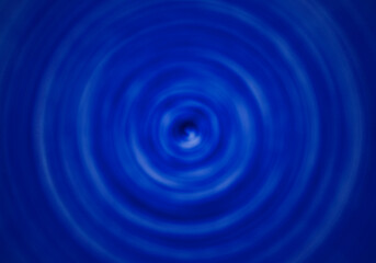 Fondo de remolino en líquido azul.