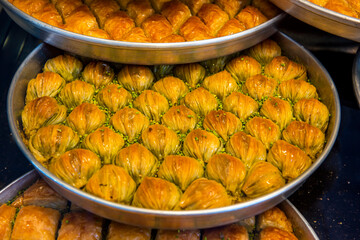 Mussel Baklava (Turkish: Midye Baklava) on tray. Traditional Baklava from Gaziantep, Turkey. Baklava with pistachio.