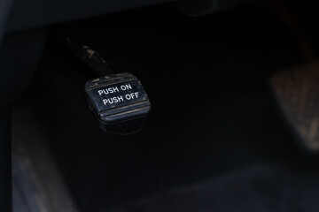 Close up view of parking brake pedal. Parking brake of a modern car.