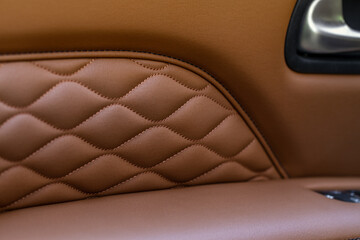 High angle view of modern car fabric seats. Close-up car seat texture and interior details. Detailed image of a car pleats stitch work.