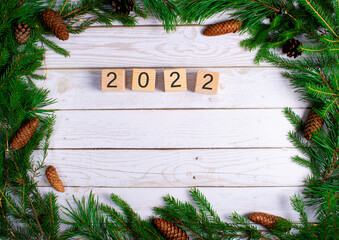 
Christmas background. the year 2022 on wooden cubes. 
