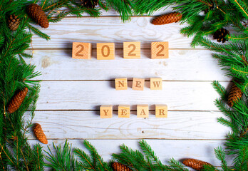 
Christmas background. the year 2022 on wooden cubes. New year