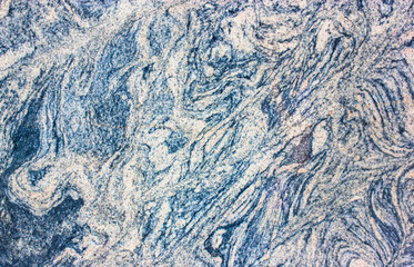 Marble granite. Natural decorative stone with gray and blue streaks. Natural granite background and texture. Abstract rock pattern. Uses for interior exterior floor or wall ceramic, home decoration.