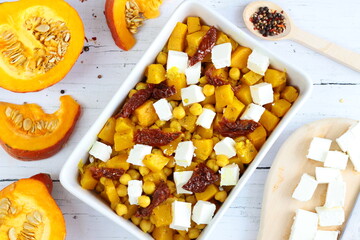 Roasted pumpkin and chickpeas salad with feta cheese and sun-dried tomatoes