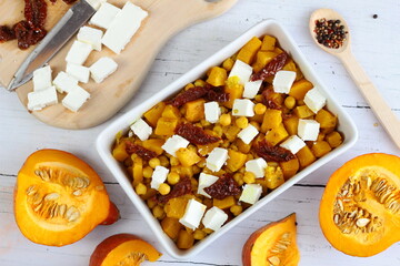 Roasted pumpkin and chickpeas salad with feta cheese and sun-dried tomatoes