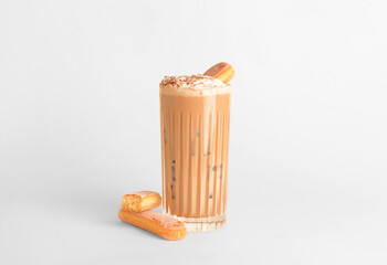 Glass of tasty Tiramisu Latte on light background