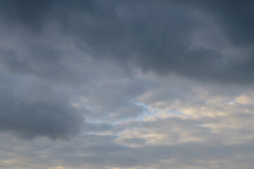 Abstract background of white fluffy clouds on a bright blue sky