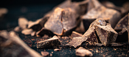Pieces of dark chocolate. Chocolate texture.