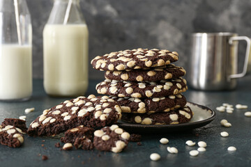 Plate with delicious chocolate cookies on table, closeup