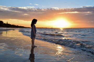girl on beach in sunset