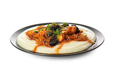 Mashed potatoes, delicious beef stew with prunes and gravy in plate on white background