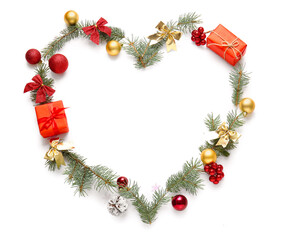 Fototapeta na wymiar Heart made of coniferous branches, gift boxes and Christmas decorations on white background