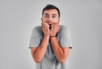 Young man in the studio on a gray background