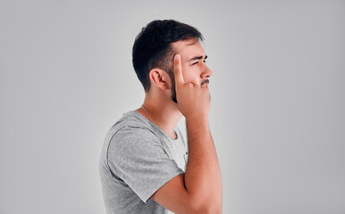 Young man in the studio on a gray background