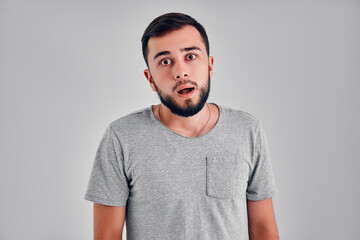 Young man in the studio on a gray background